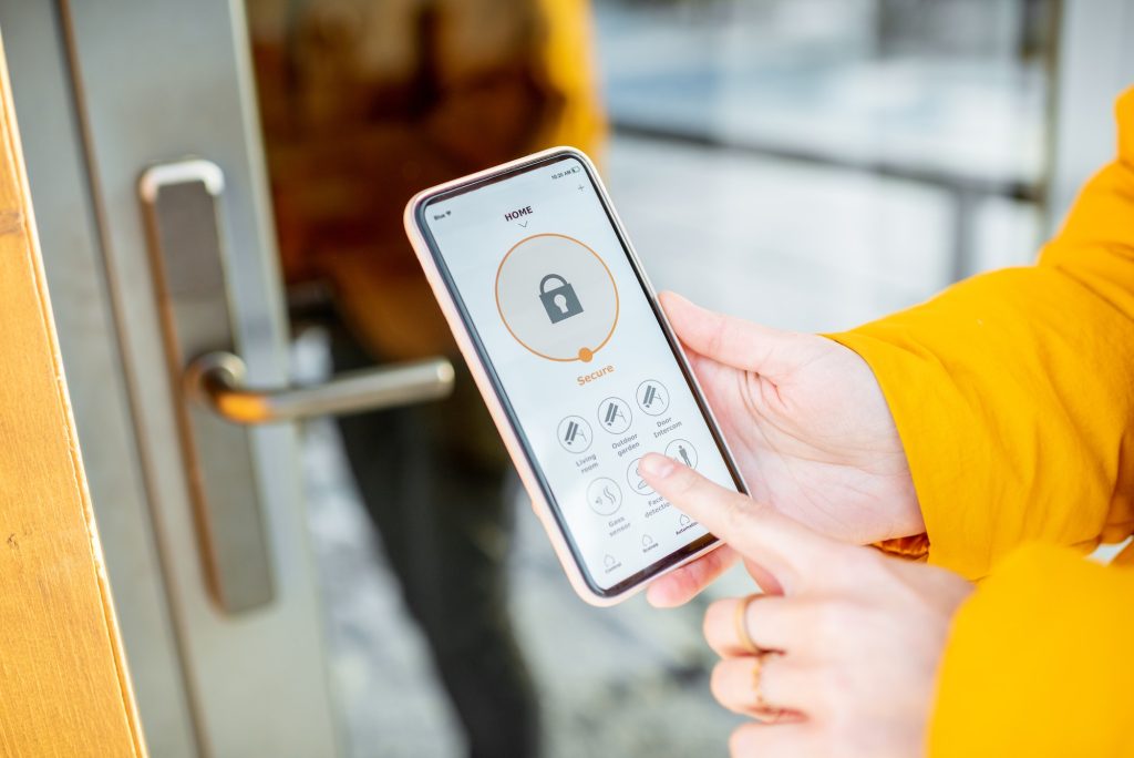 Locking entrance door with a smart phone